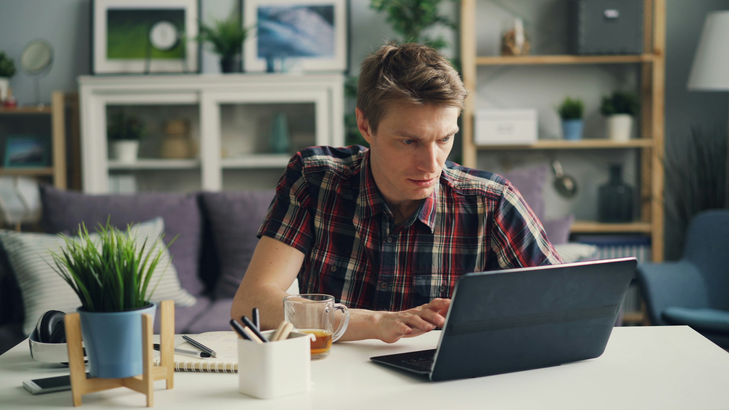 man focused on completing work - Articleforge