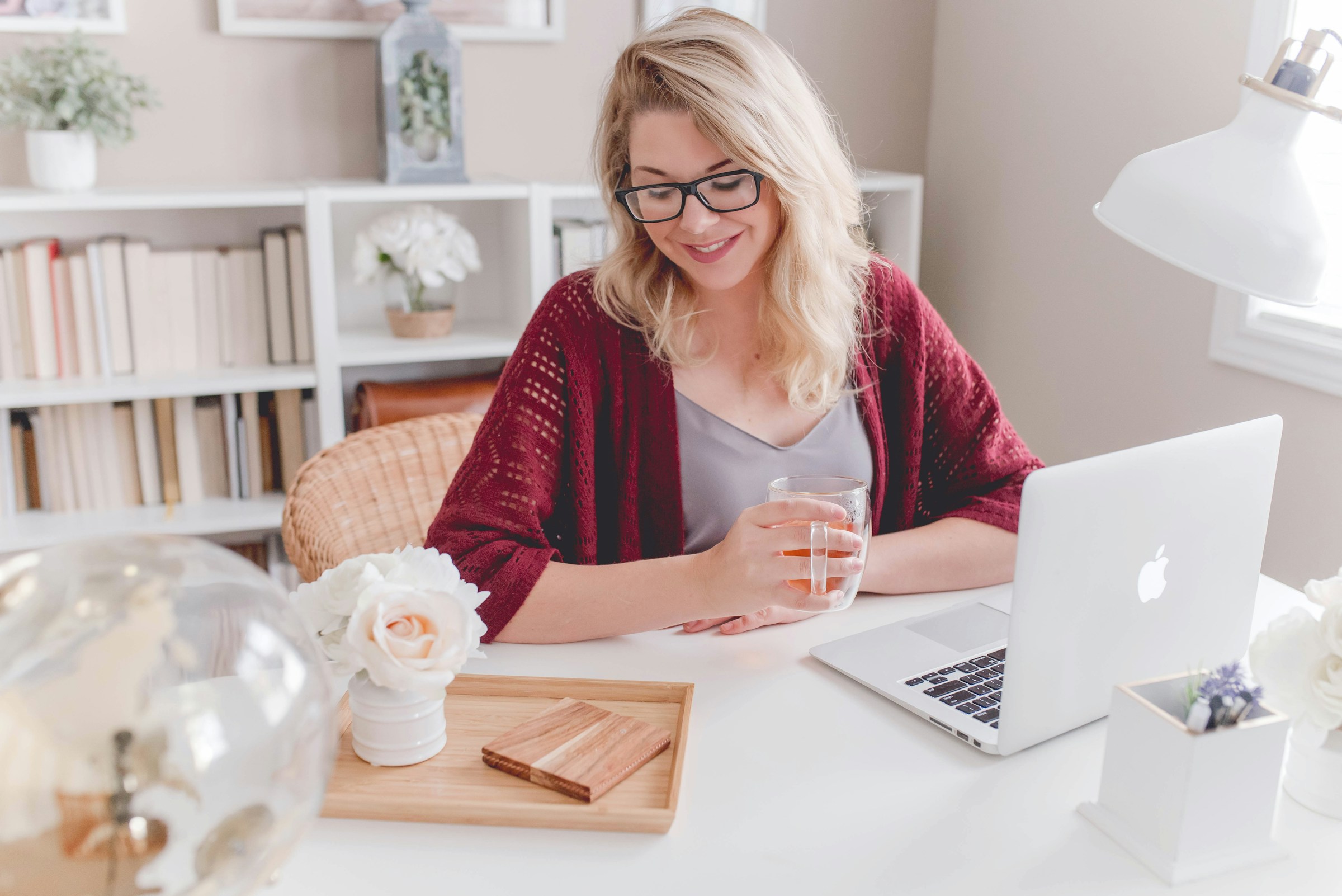 woman looking happy with work - Automated Blog Content