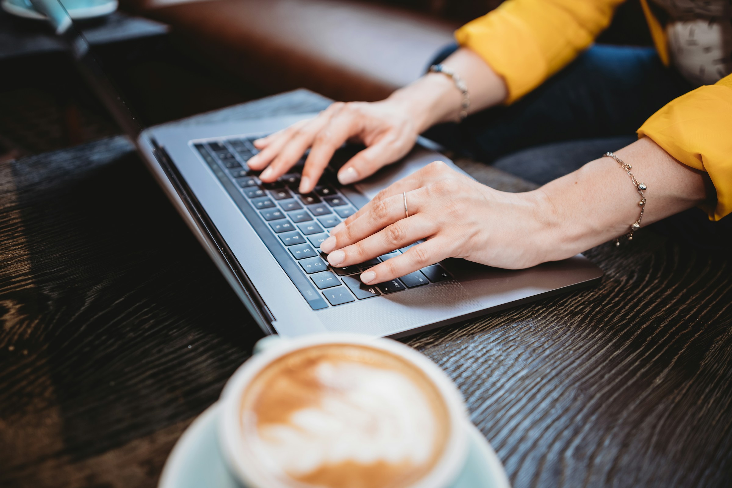 woman typing on laptop - Hyperwrite 