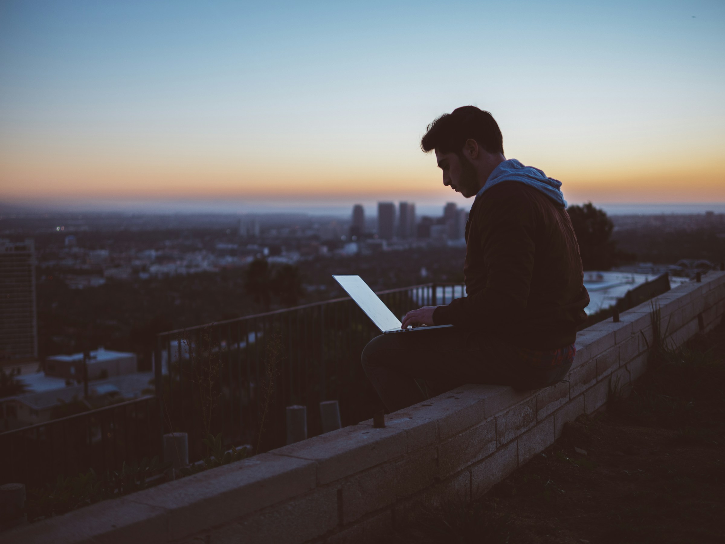 man sitting on roof top - Shortly AI