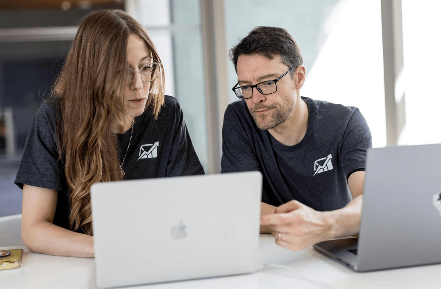 woman teaching junior how to Automate Blog Posts