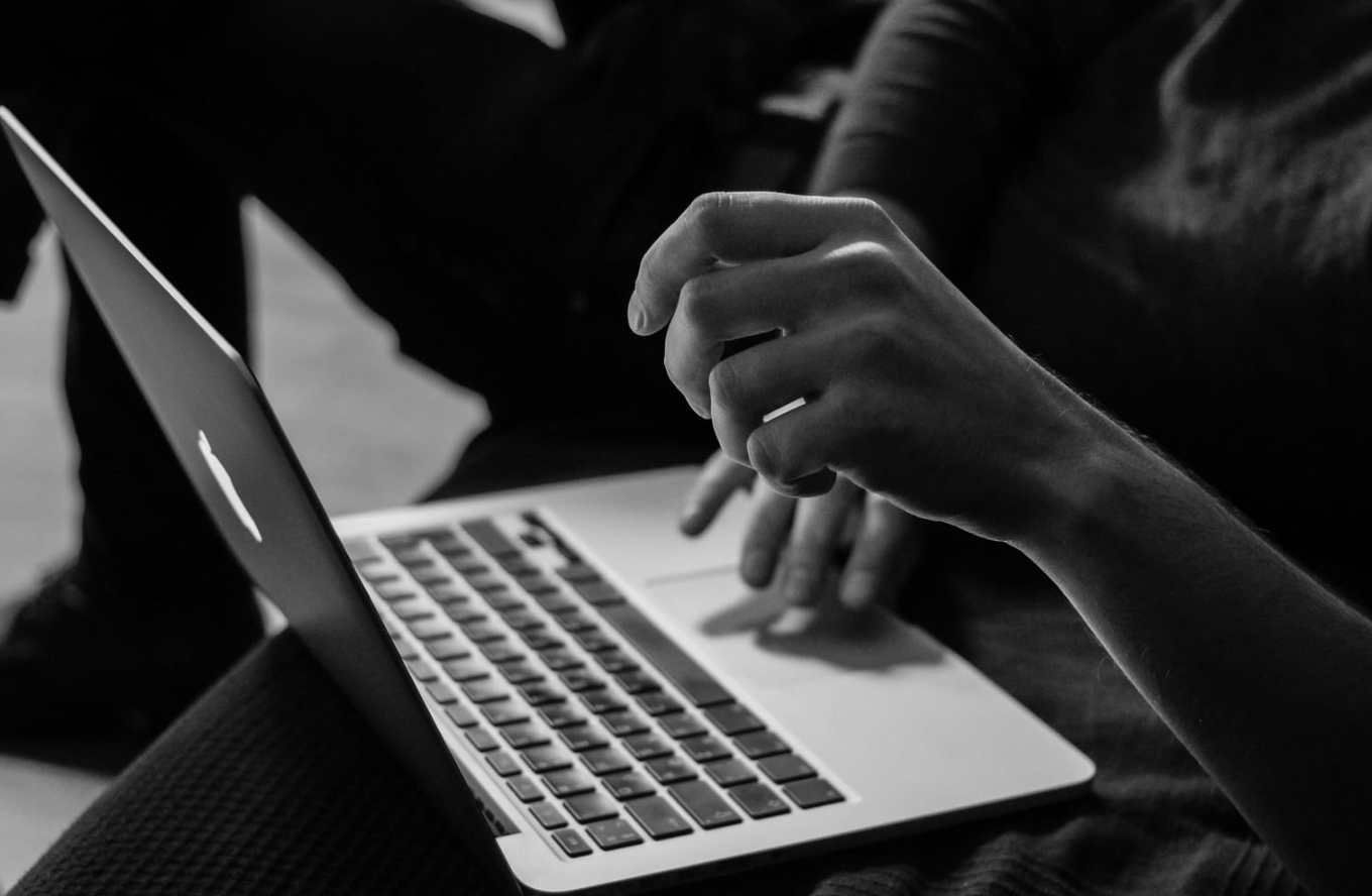 woman working hard on laptop - Best AI Writing Assistant