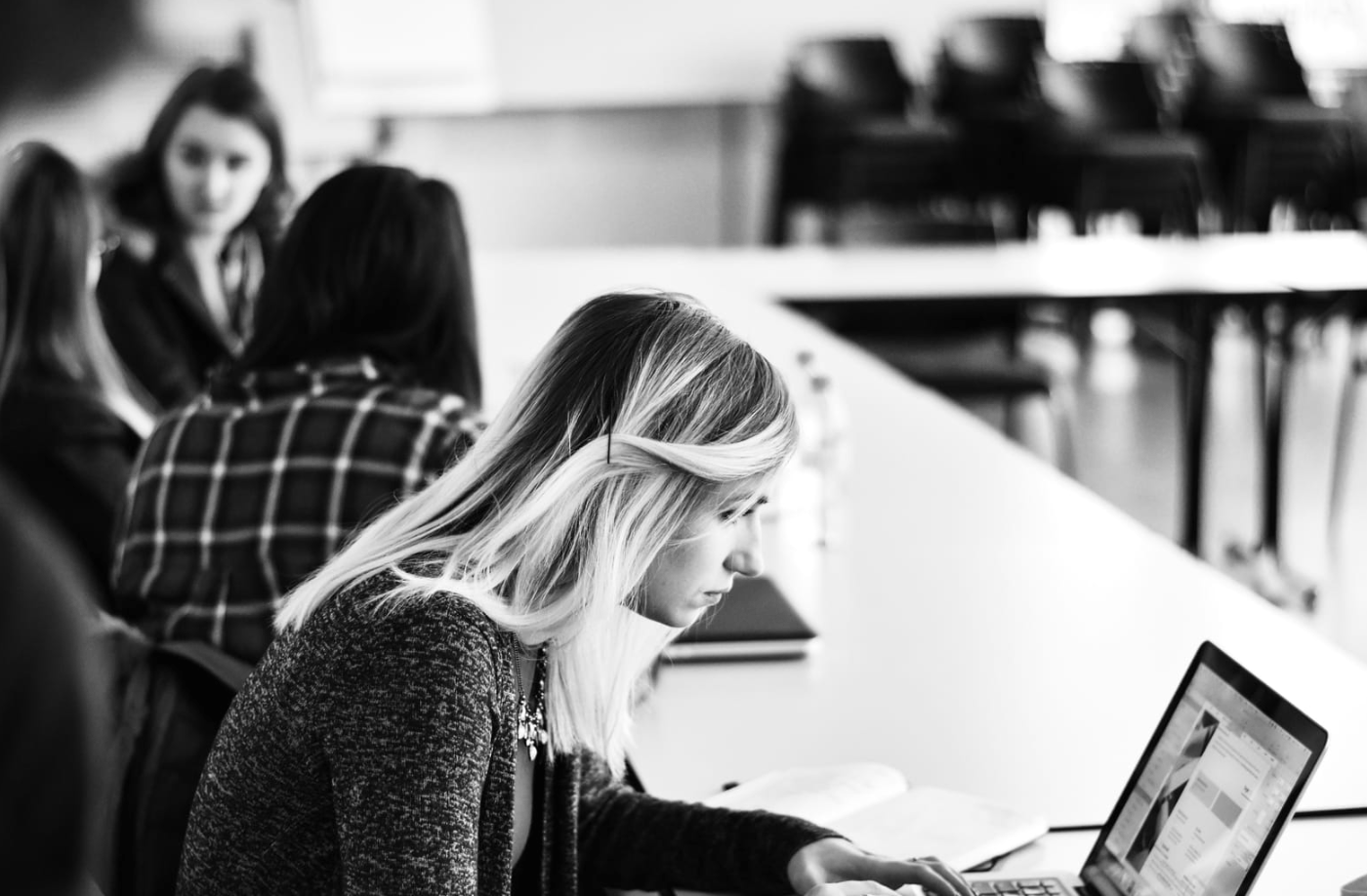 woman working hard with Best AI Writing Assistant