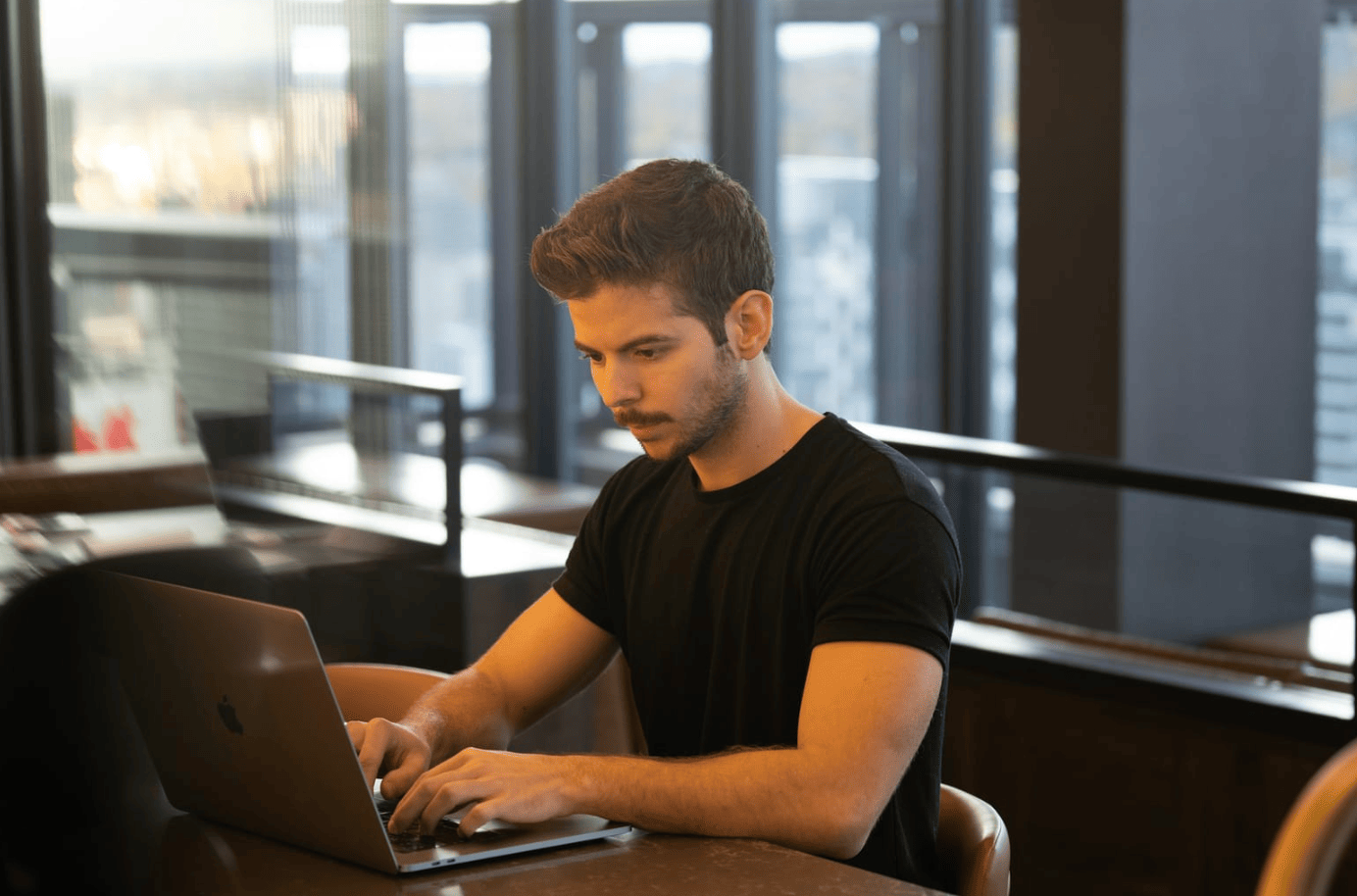 man in agency office working with AI SEO Optimization Tools