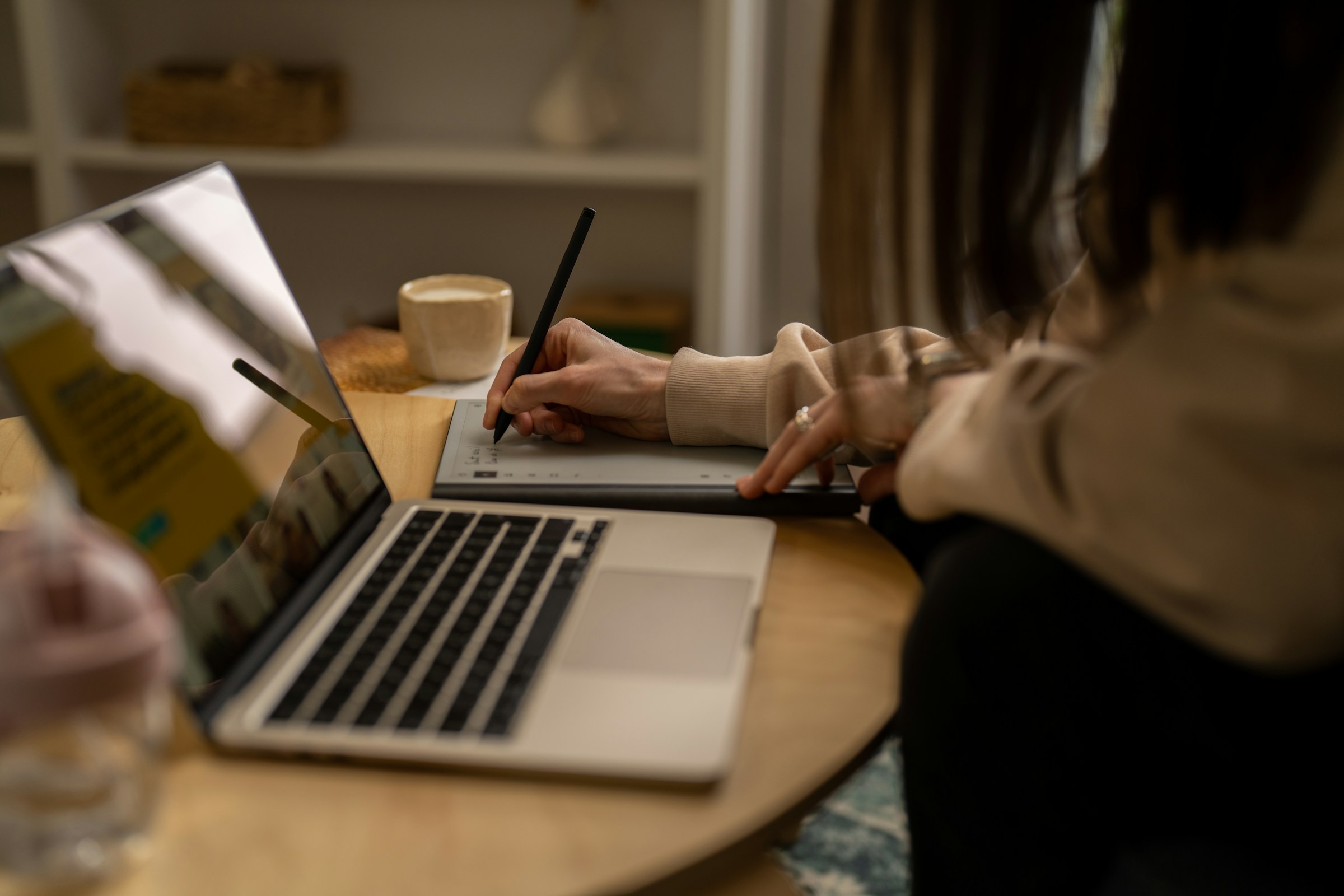 woman making notes and using tool - Articleforge