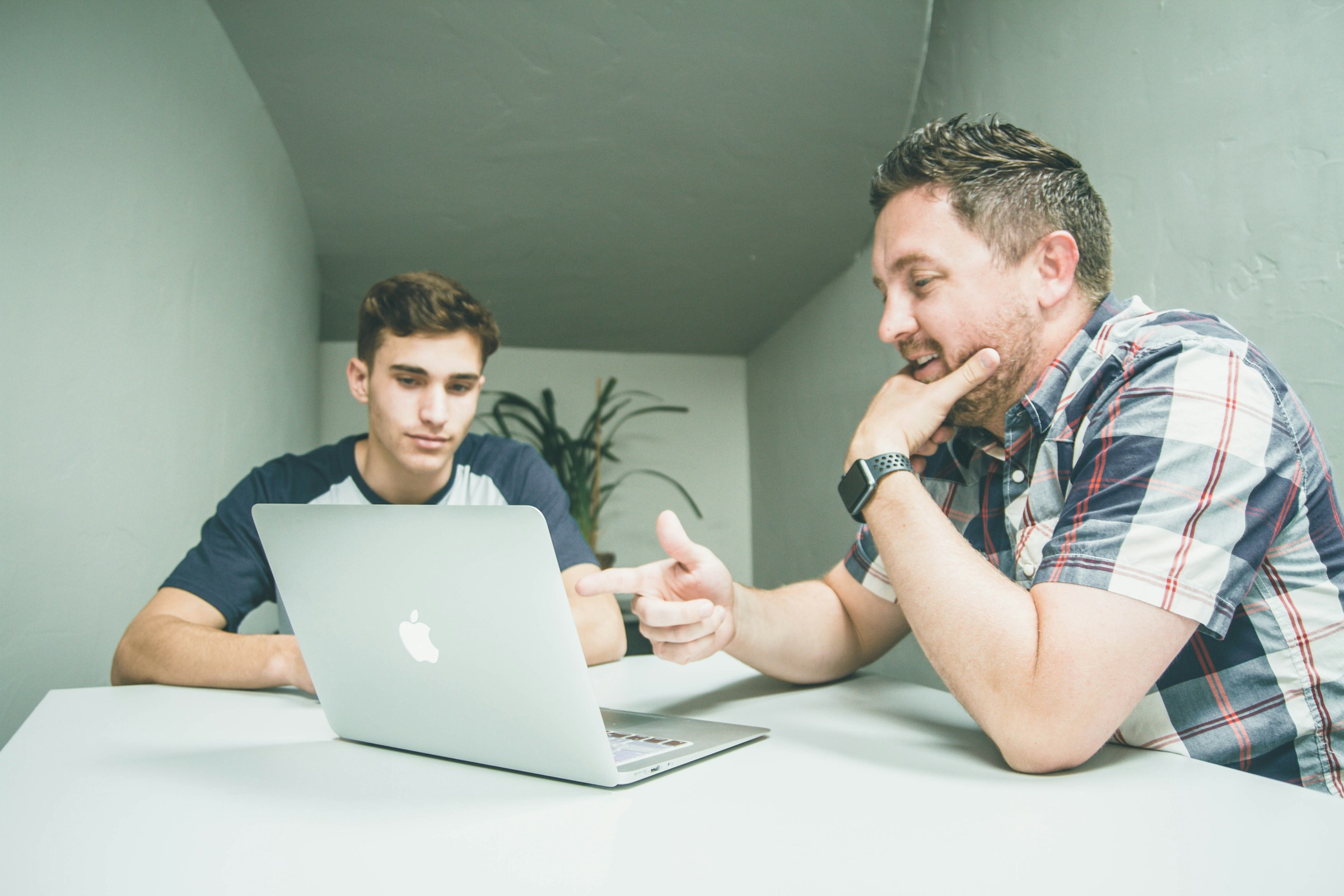 Men Discussing - AI Content Optimization