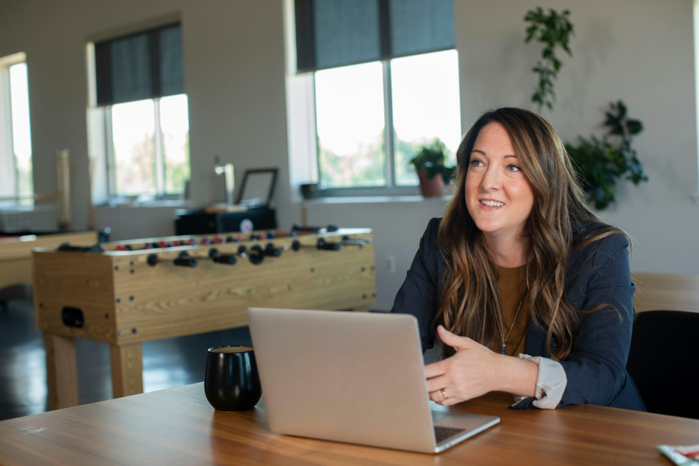 Woman Using Laptop - Automate Content Creation