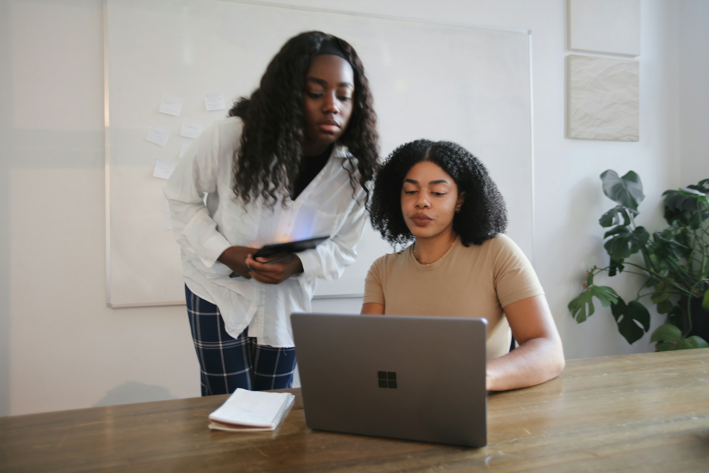 person sitting on desk - Marketmuse Alternatives