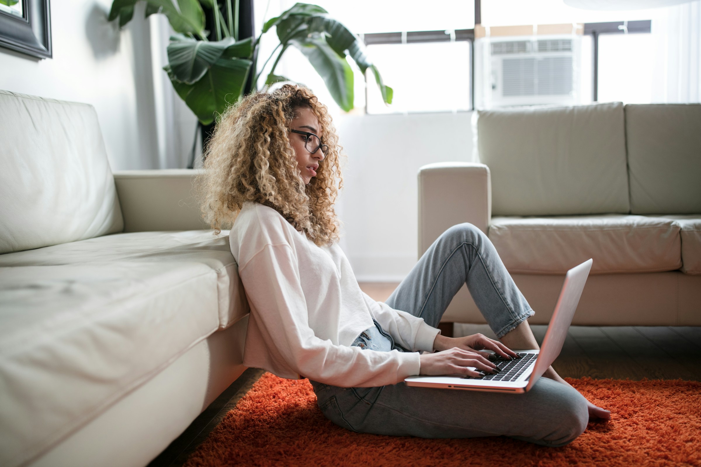 woman working alone on laptop - AI Tools For Content Writing