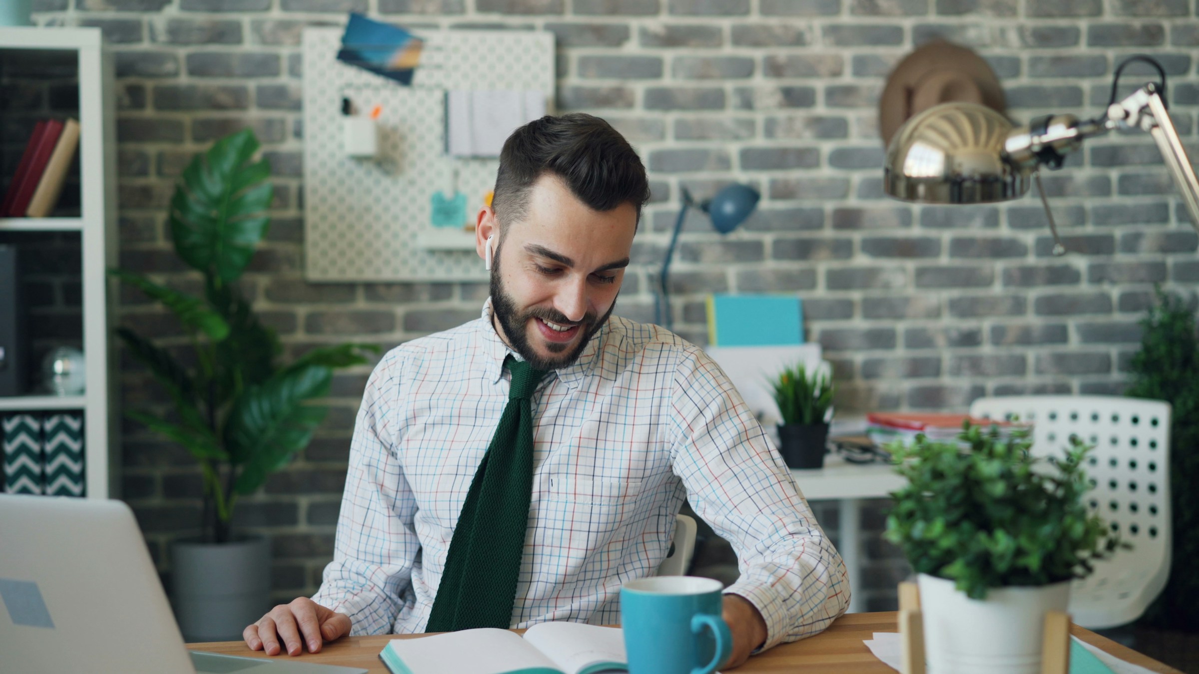 man looking at his notes - Automated Blogging 