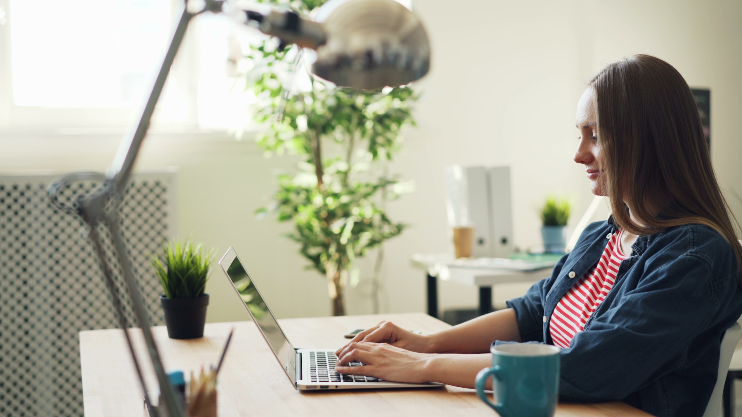 person sitting on couch and working - Automated Blogging 